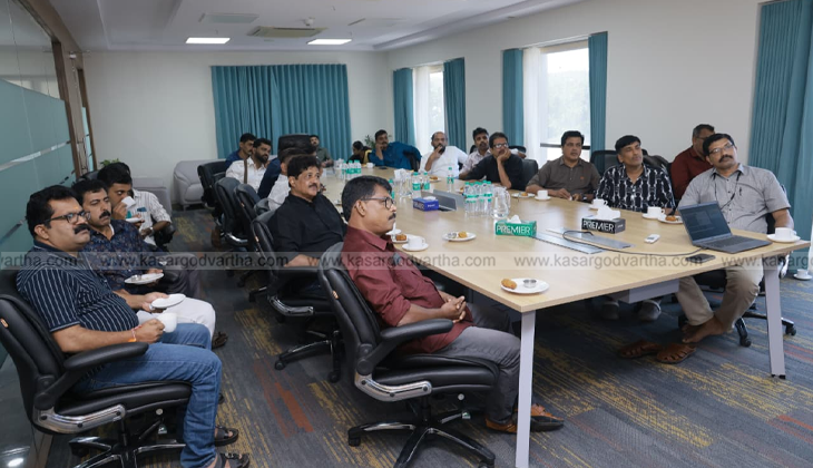 An image of the Vizhinjam International Seaport with cargo ships and cranes.