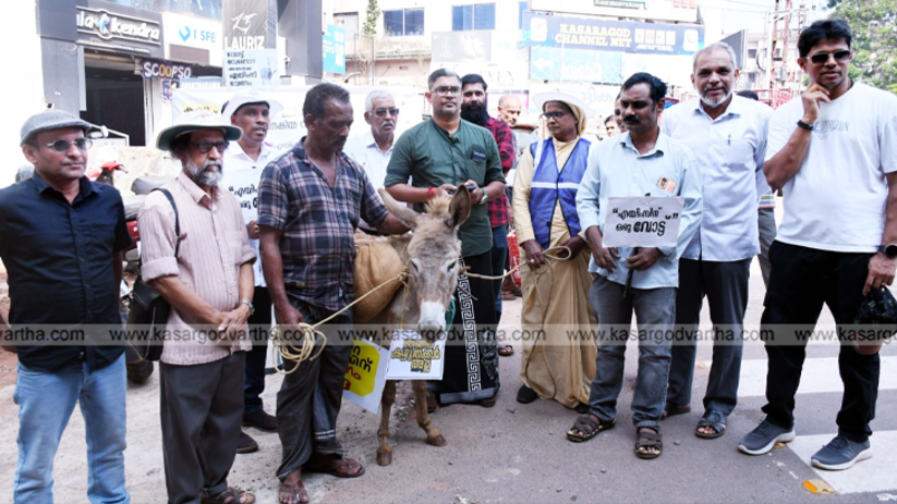 Protesters marching with a donkey in Kasaragod demanding AIIMS.