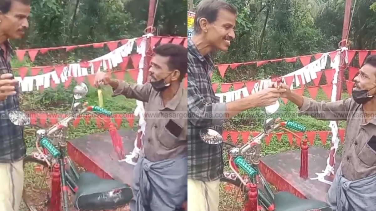 Che Guevara Rajan handing over his bicycle after losing a bet.