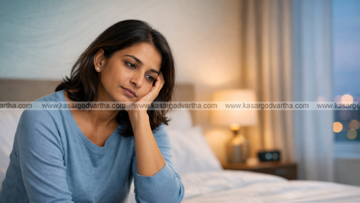 A person sleeping peacefully in a dark quiet room representing healthy sleep habits.