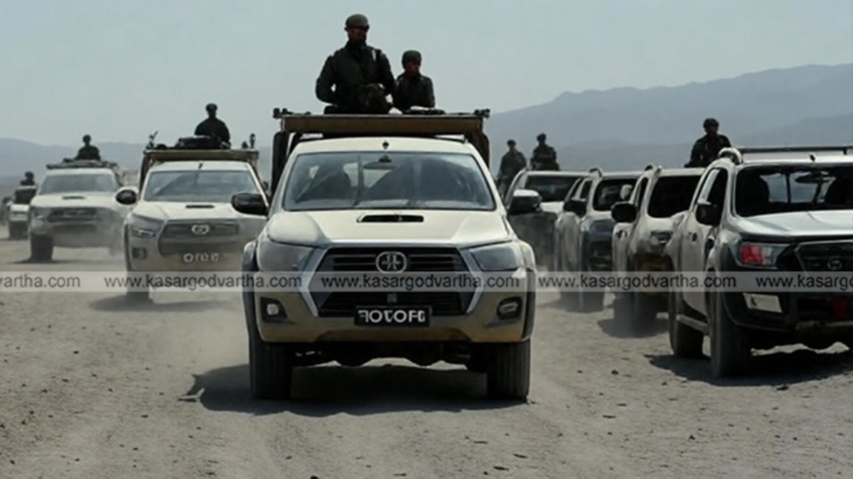 Toyota Hilux pick-up truck in an arid region.