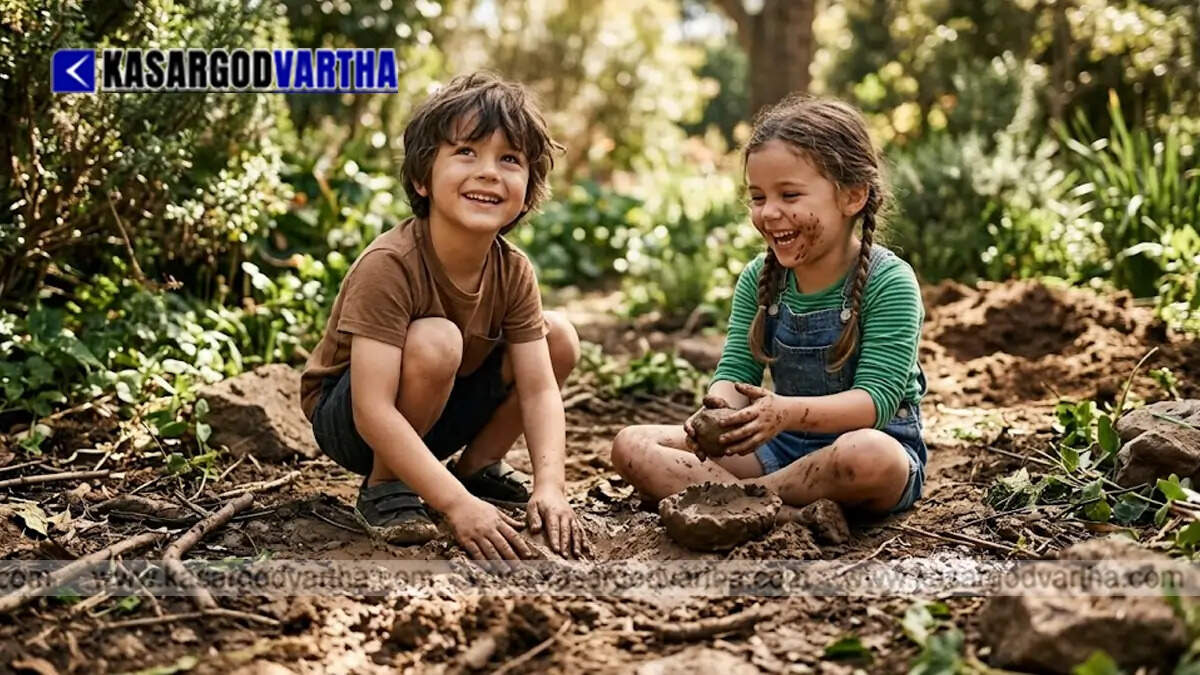 Happy children playing and getting their hands dirty in the mud