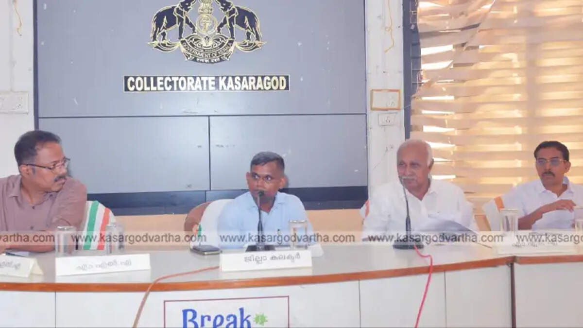 A photo of officials and local representatives discussing the action plan to address the tiger menace in Kasaragod.