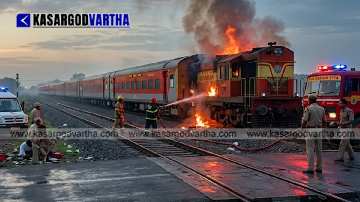 Smoke emanating from a compartment of the train stopped near a station in Rajasthan.