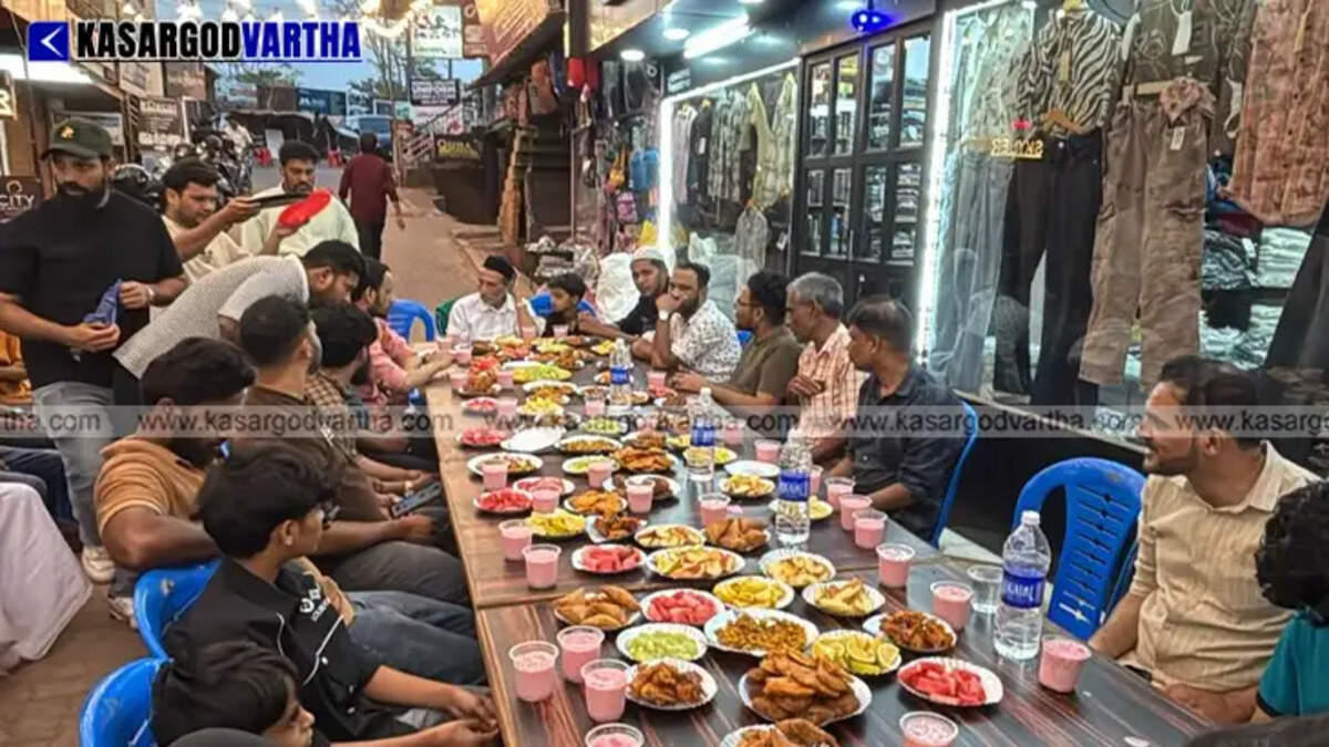 Travelers breaking their fast at an Iftar tent set up along the National Highway in Kasaragod