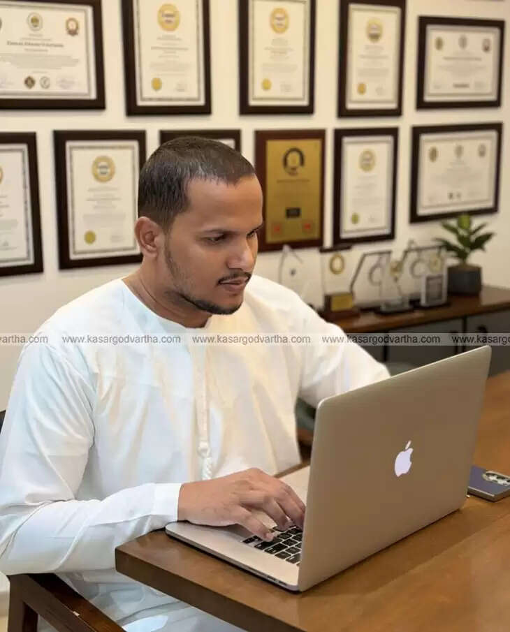 Muhammad Sabir showing his world record certificates for building 54 websites