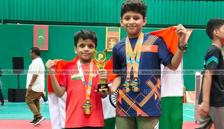Iss Al Din, a young badminton player from Kasaragod, posing with his medals.