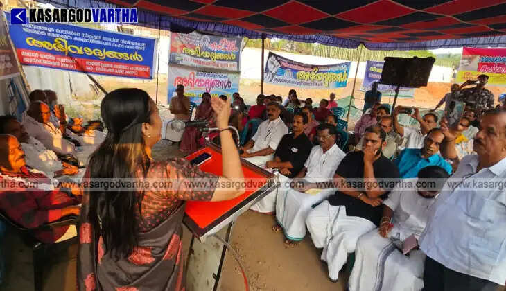Protesters sitting under a tent holding banners for a complete underpass.