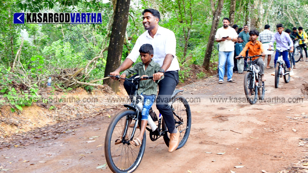 Representational image of Kasaragod Collector Arjun Pandian gifting bicycles to children