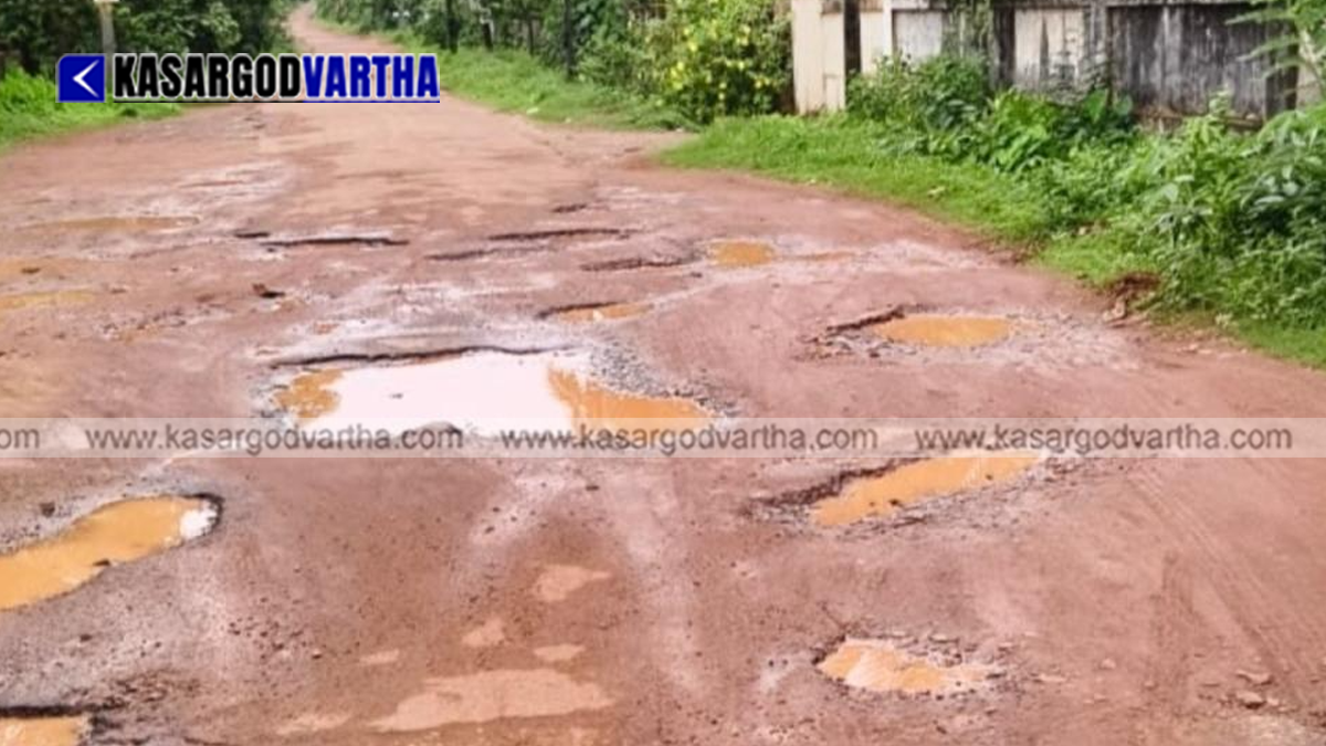 Dilapidated road with potholes and mud